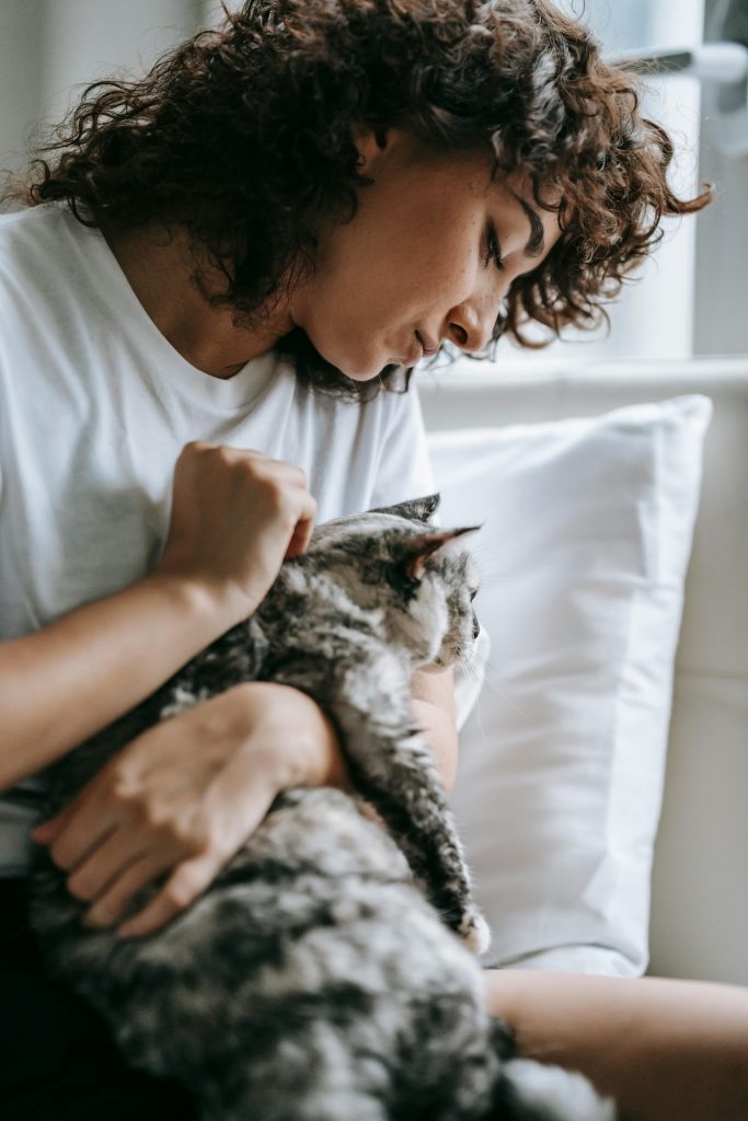 Woman with a Cat on the Bed